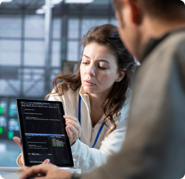 Professionals reviewing cloud infrastructure code on a tablet